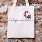 Tote Bag Cat on a line in a Christmas hat